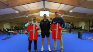 Stat Platforms and Luton Town Football Club holding the shirts