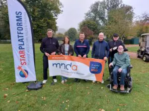 Star Platforms team holding the MND Association with Mick Grimsdale and Lauren Petchell